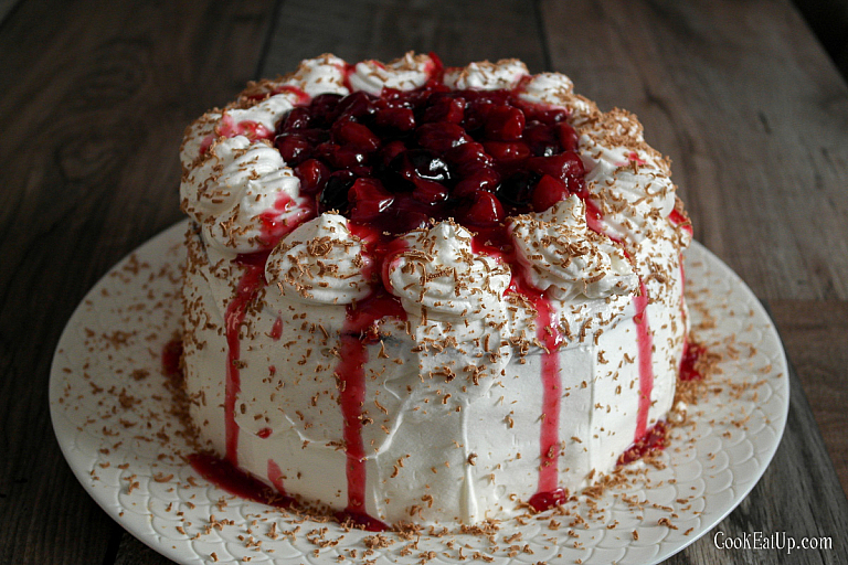 Black Forest cheesecake cake with brownies and cherry sauce