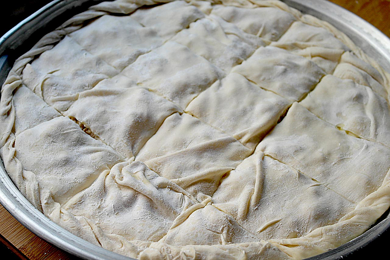 Traditional Epirus chicken pie with trachana and feta cheese
