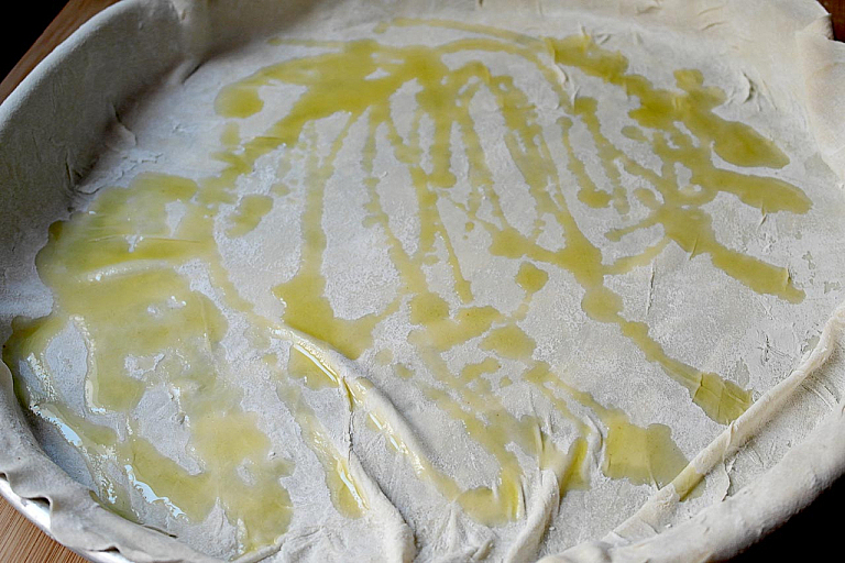 Traditional Epirus chicken pie with trachana and feta cheese