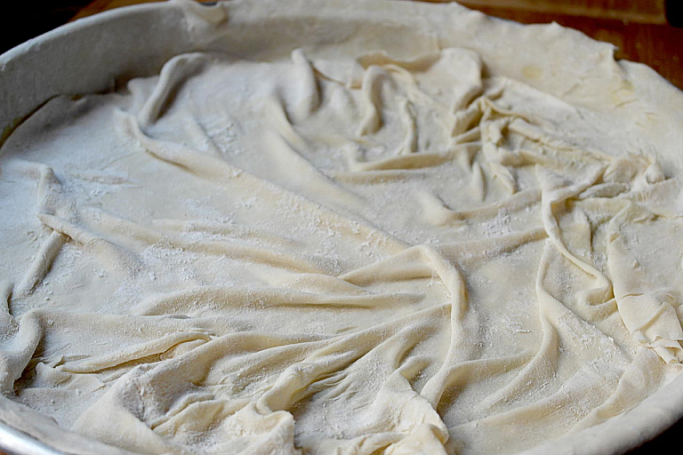 Traditional Epirus chicken pie with trachana and feta cheese