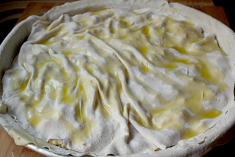 Traditional Epirus chicken pie with trachana and feta cheese